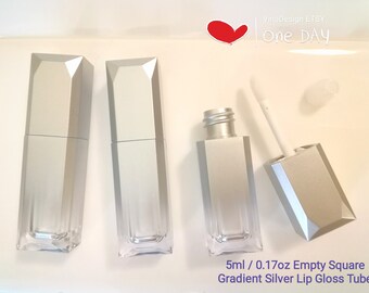 May include: Three silver square lip gloss tubes with a clear gradient effect. The tubes are 5 ml or 0.17 oz.  The image also shows a lip gloss applicator and a clear cap.