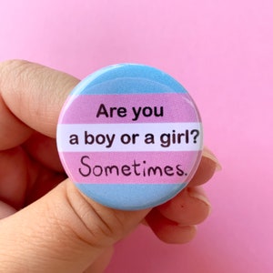 Are you a boy or a girl? Sometimes. | Trans Pride Flag 1.25” inch Pin Back Button | Transgender | Funny LGBTQ+ Gift