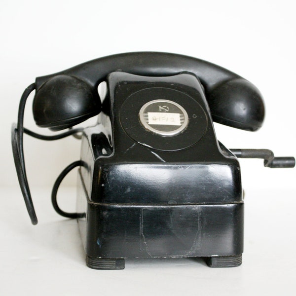 Vintage telephone.  Black Kellogg red bar switchboard hand crank desk phone.