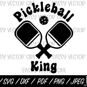 May include: Black and white graphic featuring crossed pickleball paddles, a pickleball, and the word "Pickleball" above "King." The image includes file format options: AI, SVG, DXF, PDF, PNG, and JPEG.