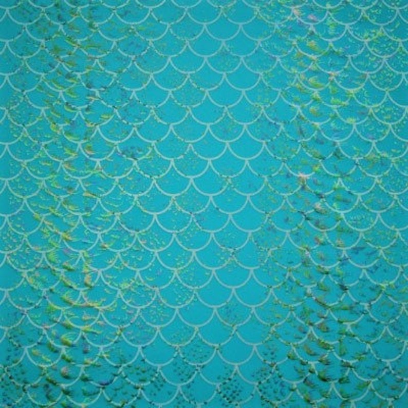 May include: A teal background with a white scale pattern, reminiscent of mermaid scales. The scales are arranged in neat rows, creating a textured effect. Subtle yellow and green accents add depth and visual interest to the design.