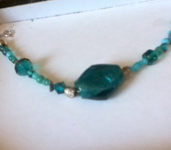 Items similar to Teal colored beaded wire bracelet with beautiful ...