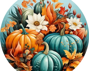 May include: A circular graphic illustration featuring a vibrant orange pumpkin, two teal pumpkins, and two white flowers. The arrangement is surrounded by autumn foliage in shades of orange, yellow, and brown, set against a light blue background.