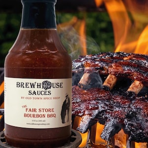 May include: A bottle of Brewhouse Sauces The Fair Store Bourbon BBQ sauce with a black cap and a white label. The label features the text Brewhouse Sauces by Old Town Spice Shop, The Fair Store Bourbon BBQ, and 15 fl oz (445 ml).