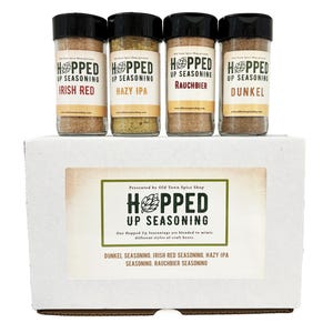 May include: A white box with a label that reads "Hoped Up Seasoning" and contains four glass jars of seasoning labeled "Irish Red", "Hazy IPA", "Rauchbier", and "Dunkel".