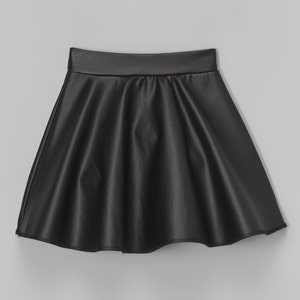May include: A black faux leather skater skirt with a smooth, shiny finish.