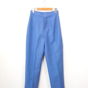 May include: High-waisted trousers in a solid cornflower blue color. These pants feature a structured waistband with a single centered button closure, a front zipper fly, and a straight-leg cut with a pressed crease running down the center of each leg.