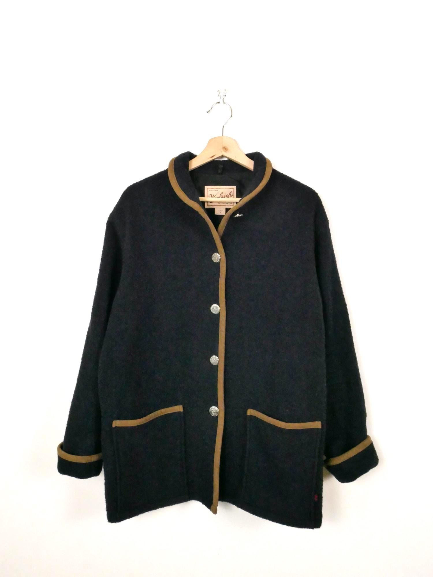 Set of suits with jacket coat sweater on hanger | Premium AI-generated