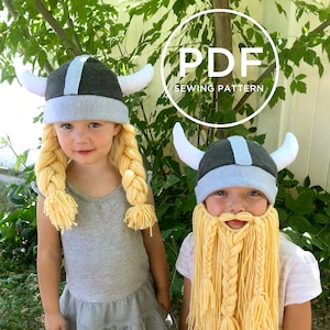 May include: Two children wearing Viking hats. The girl's hat has long blonde braids and the boy's hat has a long blonde beard. The hats are grey and white with horns. The children are smiling and looking at the camera.  PDF SEWING PATTERN.