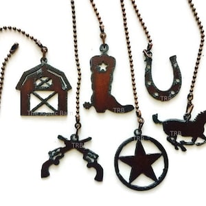 May include: Six rustic metal fan pull chains with different western themed designs. The designs include a barn, a cowboy boot, a horseshoe, a horse, a pair of pistols, and a star. The chains are made of copper-toned metal.
