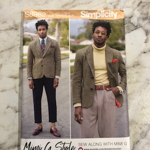 May include: A sewing pattern for a blazer and pants. The pattern is from Simplicity and is called "Mimi G Style". The pattern is for sizes 34-42. The pattern includes a photo of a model wearing the blazer and pants.
