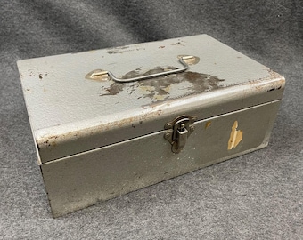 Vintage gray metal utility box. Rusty beat-up industrial container art supplies caddy tool box