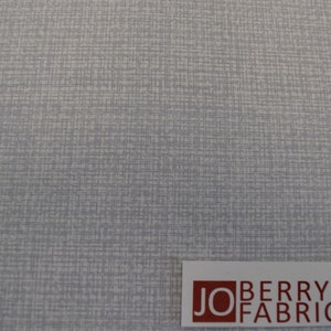 May include: A close-up of a light gray fabric with a subtle woven pattern. The fabric has a slightly textured surface. The text "JO BERRY FABRICS" is visible in the lower right corner of the image.