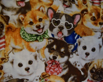 May include: A colorful fabric with a repeating pattern of cartoon puppies. The puppies are in various poses and wearing different accessories, including a bow tie, sunglasses, and a bandana.