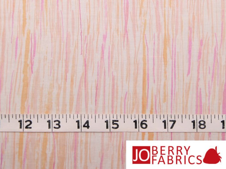 May include: White fabric with thin pink and orange stripes. A white measuring tape with black numbers is placed on top of the fabric. The numbers on the tape read 12, 13, 14, 15, 16, 17, 18, and 19.