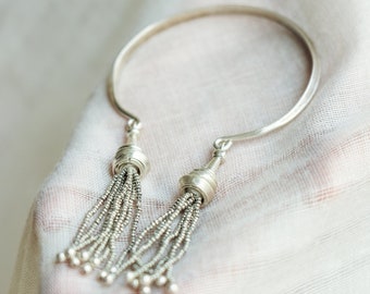 Open silver bangle with pagoda pendants and tassel endings (B0090A)