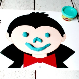 May include: A printable Dracula face template with the word "Dracula" at the top. The face has a black outline and is ready for play dough eyes, nose, and mouth.