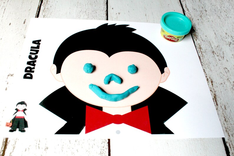 May include: A printable Dracula face template with the word "Dracula" at the top. The face has a black outline and is ready for play dough eyes, nose, and mouth.