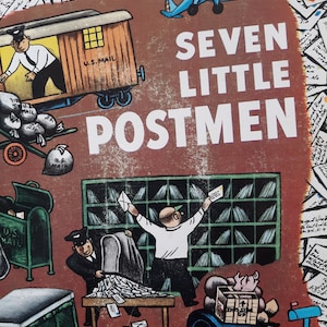 May include: A vintage children's book cover illustration featuring seven cartoon mail carriers delivering mail. The cover is red with the title "Seven Little Postmen" in white letters. The illustration features a mail truck, mailboxes, and a plane.