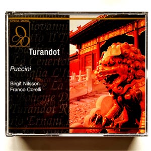 May include: A CD case featuring a red and gold image of a Chinese temple and a red lion statue. The text on the case reads "Opera d'Oro", "Turandot", "Puccini", "Birgit Nilsson", and "Franco Corelli".