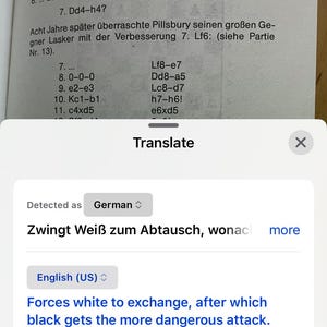 May include: A screenshot of a phone screen showing a chess game with the text "Zwingt Wei&szlig; zum Abtausch, wonach" in German, which translates to "Forces white to exchange, after which" in English. The text "Forces white to exchange, after which black gets the more dangerous attack. 13. Lh6: gh6: 14. Dh6: would be after Lasker on 14th ... Se5! Along with Tic8 failed." is also visible on the screen.