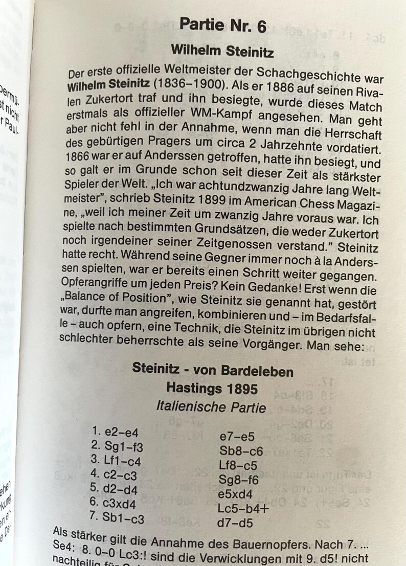 May include: A page from a chess book featuring a black and white photograph of Wilhelm Steinitz, the first official world chess champion. The text discusses Steinitz's chess strategy and includes a chess game notation.