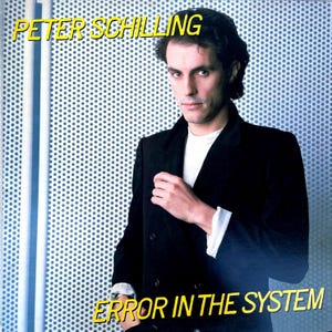 May include: Album cover featuring Peter Schilling in a black blazer over a white shirt, with the text "PETER SCHILLING" and "ERROR IN THE SYSTEM" in yellow. The background is a pattern of small blue dots.