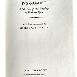 May include: A book titled "Charles H. Dow: Economist" with a subtitle "A Selection of His Writings on Business Cycles". The book is edited by George W. Bishop, Jr. and published by Dow Jones Books in Princeton, New Jersey.