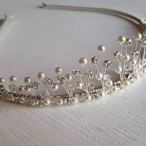 A beautiful traditional pearl and diamante tiara bride wedding