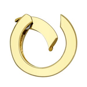 May include: A gold-toned metal clasp with a circular design. The clasp is open and ready to be attached to a chain or other jewellery.