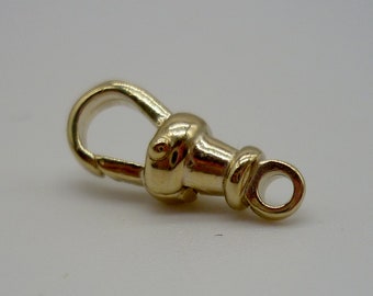 May include: A gold-toned metal watch chain clasp with a loop on one end and a hook on the other.