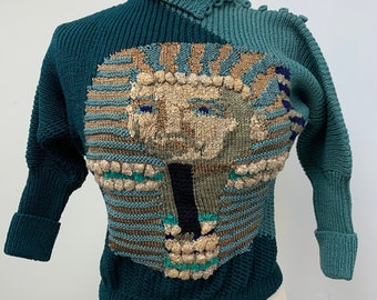 1980s  green vintage pullover sweater with Pharoah intarsia, lace and popcorns. Very detailed. Size SMALL