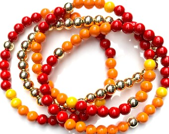 Red and Orange Colorful Bunch of Stretchy Bracelets. Round Enamel Beads. Gold beads. Set of 4.