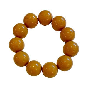 May include: A brown beaded bracelet with round beads.