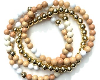 Tan, White, Linen Bunch of Stretchy Bracelets. Round Enamel Beads. Gold beads. Set of 4.