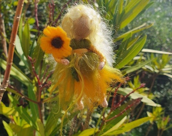 Little fairy child with sunflower