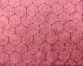 May include: Red fabric with a black hexagonal pattern. The fabric has a textured surface.