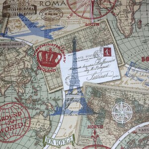 May include: A beige fabric with a vintage travel theme. The design includes world maps, postcards, compass roses, and stamps. The Eiffel Tower and the Colosseum are also featured. Text includes "ROMA", "AROUND THE WORLD", and "BON VOYAGE".