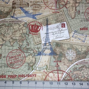 May include: A fabric with a vintage travel theme, featuring world maps, compasses, and postcards. The design includes text such as "Around the World" and "Book Your Holidays" in red and green. The color palette is primarily beige, green, and brown.