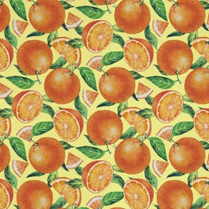 May include: A repeating pattern of oranges, orange slices, and green leaves on a yellow background. The oranges are whole and halved, showcasing the fruit's texture and color. The leaves add a natural element to the design.