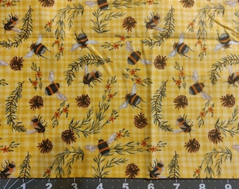 May include: Yellow fabric with a checkered pattern featuring a repeating design of bumblebees, pine cones, and sprigs of greenery.