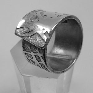 Open aluminum ring, artistically etched, with personalized text.