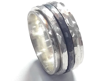 With personalized text, strling silver ring with 3 spinner rings hammered and center black.