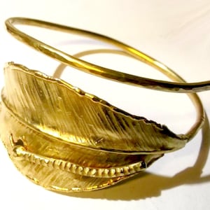 Introducing our Stunning Adjustable Brass Bracelet with Hand-Hammered Leaf and Delicate Worm Design