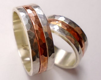 A pair of engagement sterling silver ring with faceted hammered, center of copper and custom text.