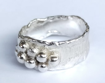 Open adjustable silver ring,  forged with melted edges and 7 seven balls - spheres. With custom text.