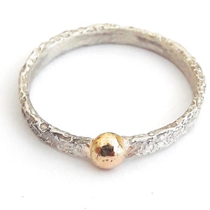 Sterling silver ring with 18 K gold drop, and personalized text.