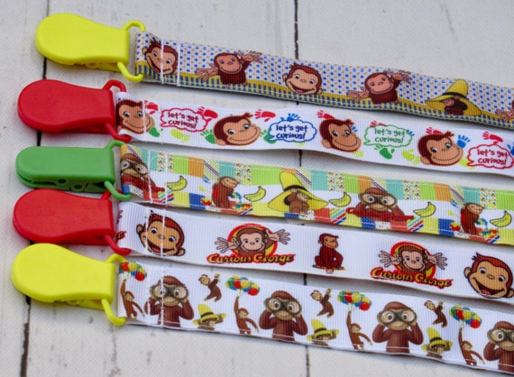 CURIOUS GEORGE PACIFIER HOLDER CLIP