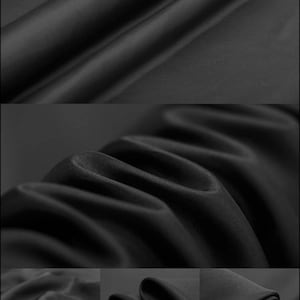 Könnte beinhalten: Nahaufnahme von schwarzem Satin-Stoff mit einer glatten, seidenartigen Textur. Der Stoff ist gefaltet und drapiert und zeigt seine luxuriöse Haptik.