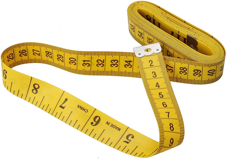 May include: A yellow measuring tape with black markings. The tape is coiled and shows numbers from 25 to 40 inches. The tape is labeled "MADE IN CHINA".
